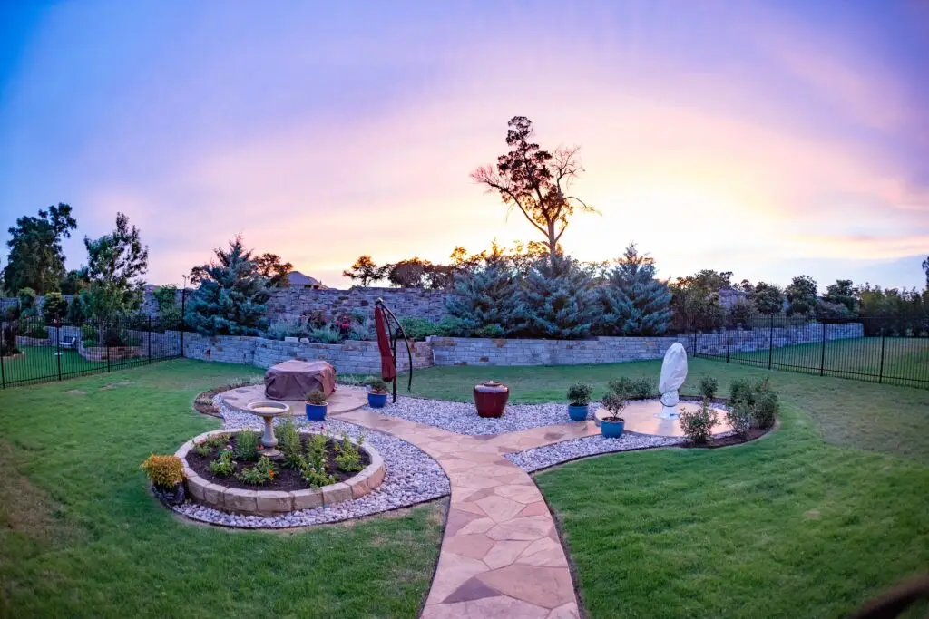 Amazing outdoor living space in Austin, TX with water feature and firepit