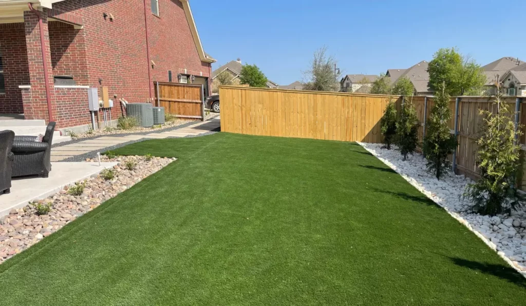 Well-maintained Central Texas yard with turf and stone borders preventing common landscaping mistakes successfully.