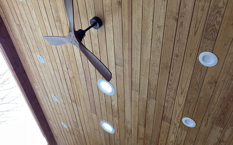 Wooden ceiling with lights and ceiling fans